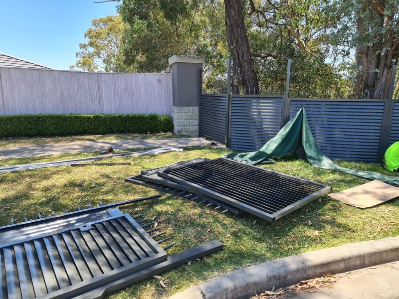 progress photo of metal fence installation